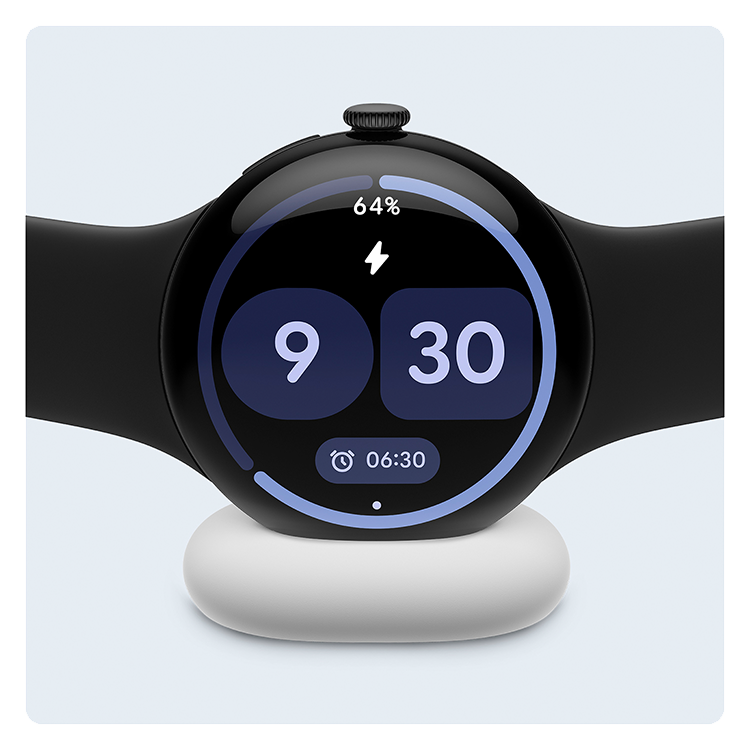 Image of a black Google Pixel Watch 4 on a white charger, against a blank background.