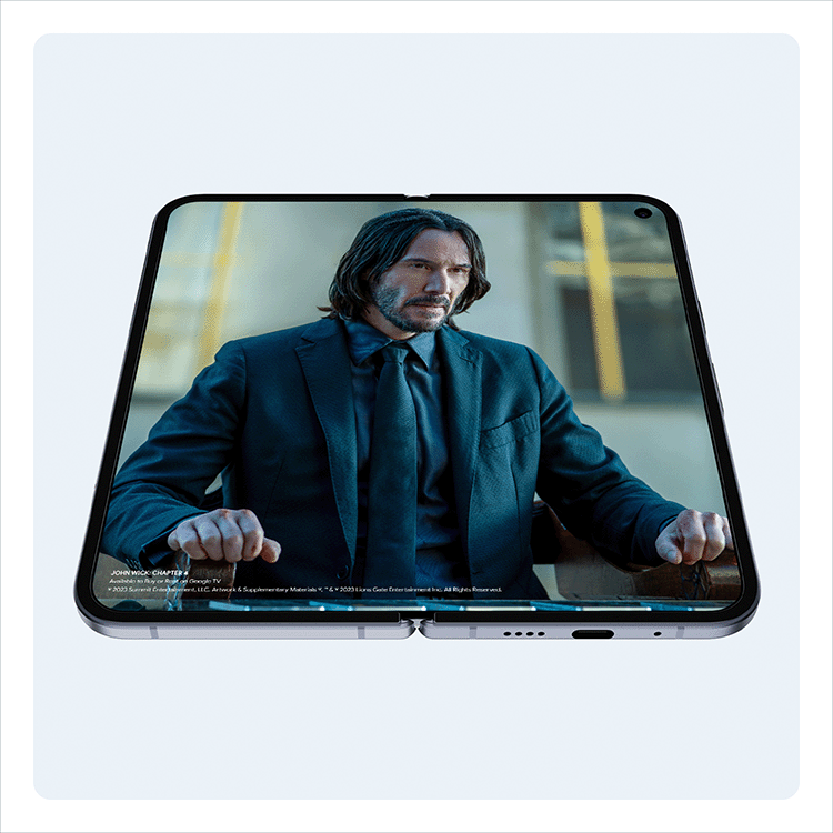 An unfolded Google Pixel 10 Pro Fold plays John Wick: Chapter 4 in full screen.